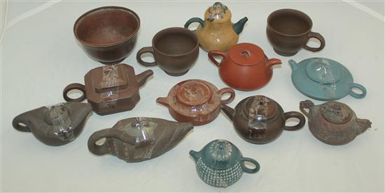 Ten Yixing pottery teapots and covers, two cups and a bowl, 20th century, 5.8cm